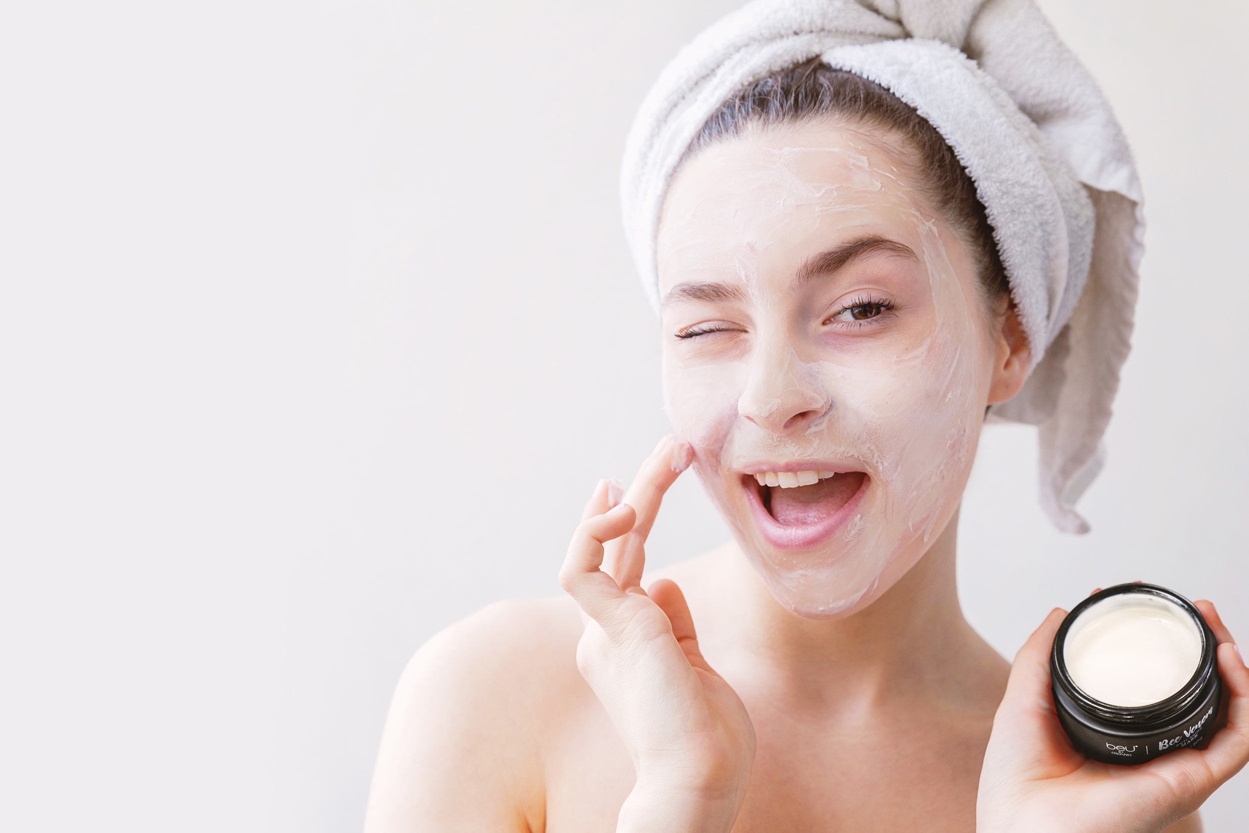 Woman applying the beU Bee Venom Anti-Aging Mask